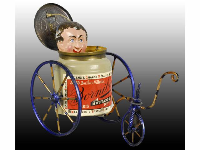 Appraisal: French -Wheel Bicycle Toy with Jar Advertisement Description When pulled