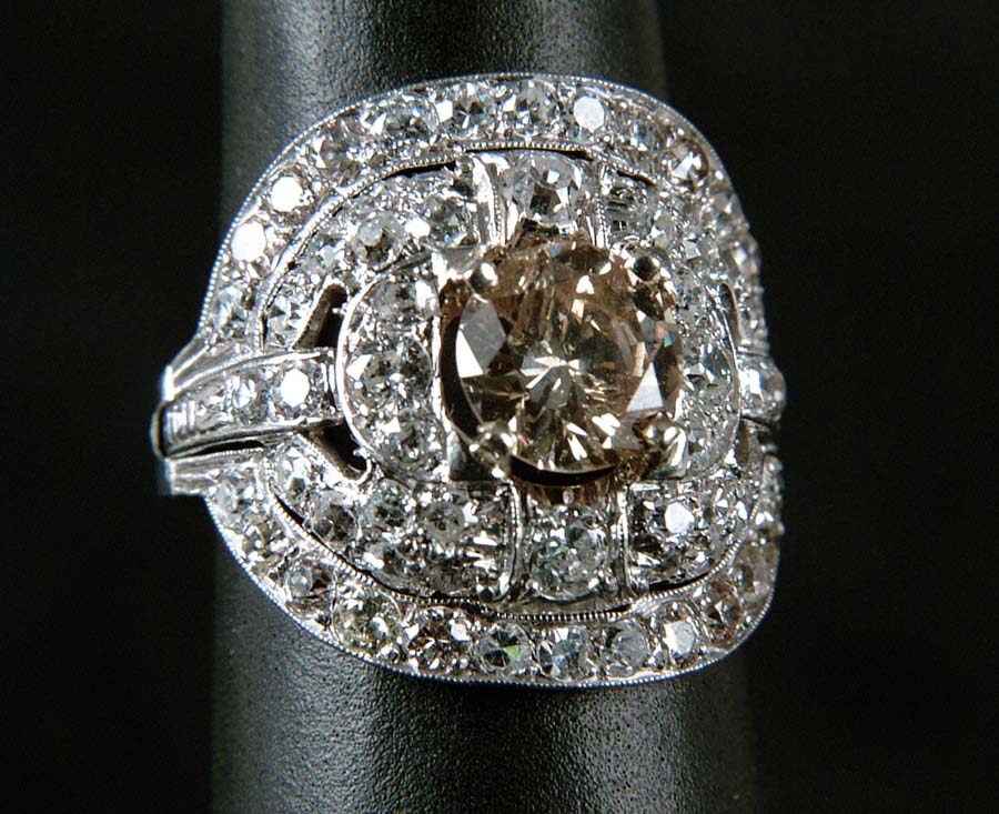 Appraisal: LADIES FANCY DIAMOND RING Outstanding platinum ring features center ct