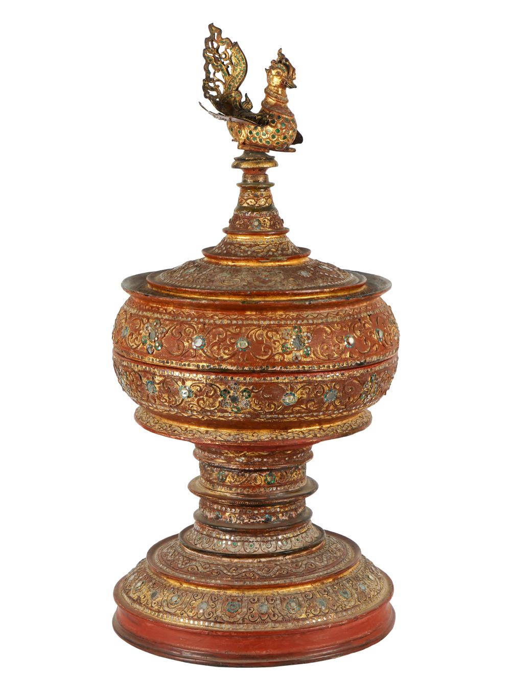 Appraisal: THAI RED-LACQUERED COVERED URNwith bird finial inset with mirror and