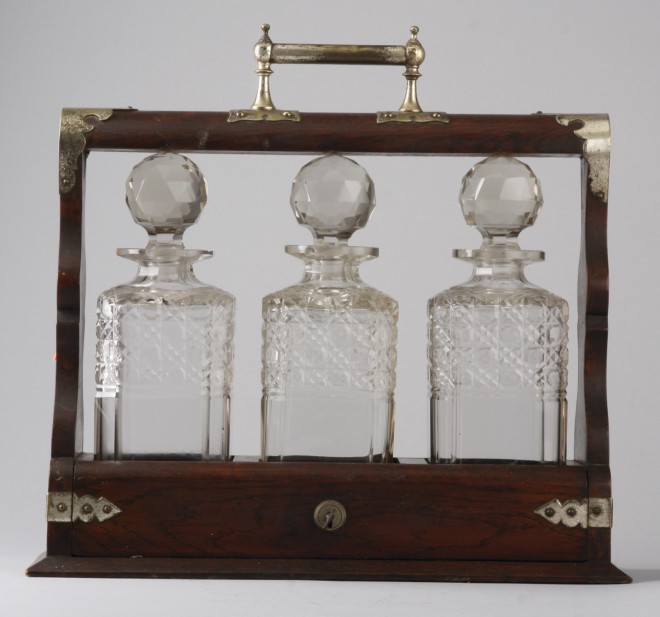 Appraisal: Lot of three clear glass decanturs housed in a wooden