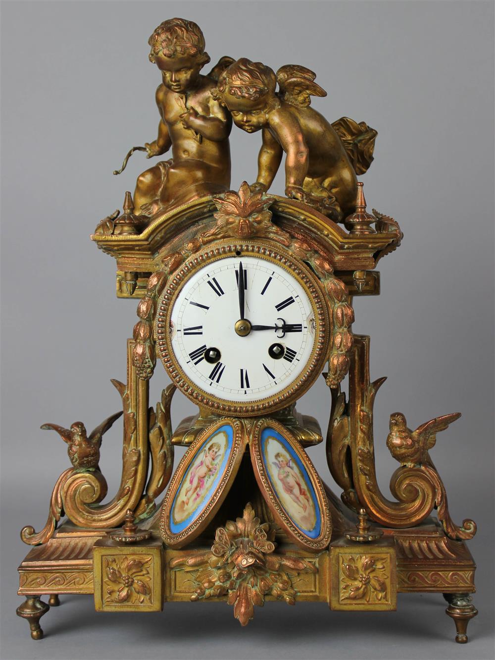 Appraisal: LOUIS XVI STYLE PORCELAIN MOUNTED COPPERED METAL MANTEL CLOCK the