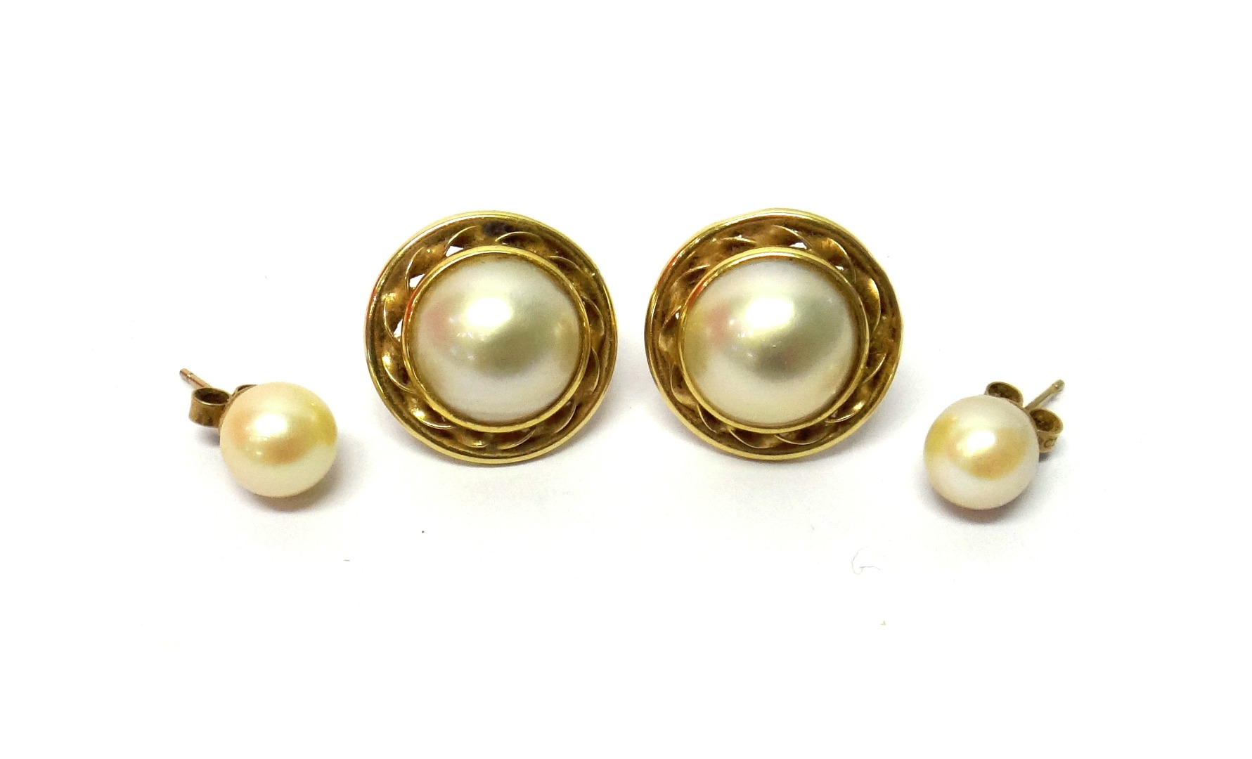 Appraisal: A pair of gold and mabe pearl set earclips each