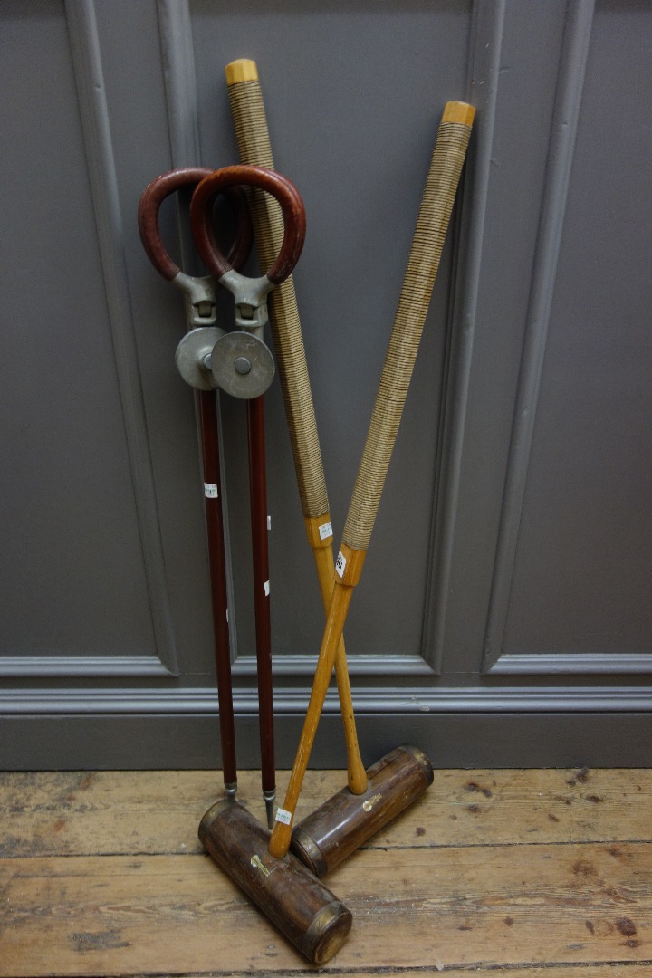 Appraisal: Two croquet mallets by Jaques London and two vintage shooting