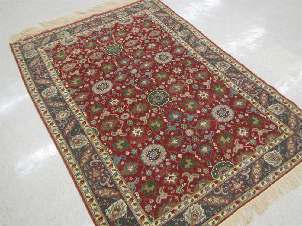 Appraisal: SEMI-ANTIQUE TURKISH AREA RUG hand knotted in an overall stylized