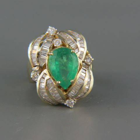 Appraisal: Emerald Diamond Ring large pear shape gem surrounded by round