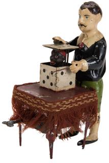 Appraisal: Antique Wind-Up Magician Toy Hand-painted German tin magician figure with