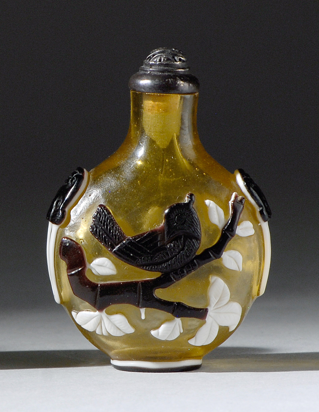 Appraisal: DOUBLE OVERLAY GLASS SNUFF BOTTLE In pear shape with aubergine