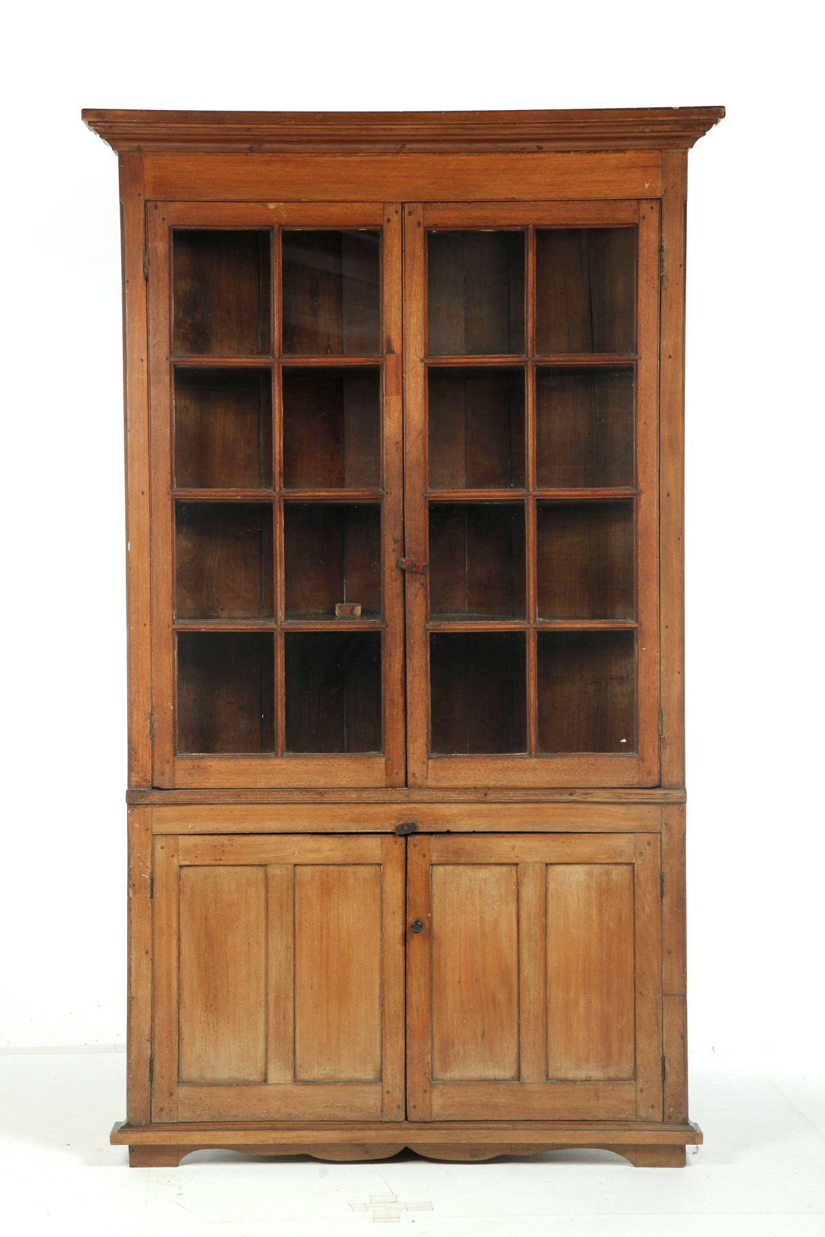 Appraisal: ONE-PIECE SIXTEEN-PANE CORNER CUPBOARD American nd quarter- th century Walnut