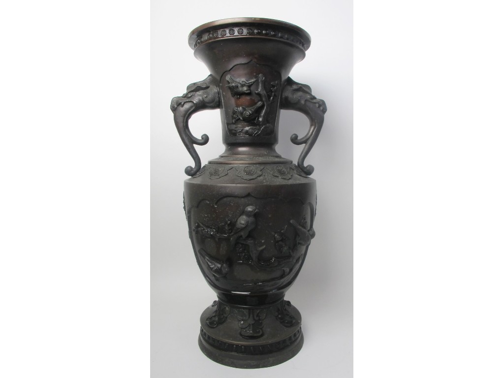 Appraisal: A Japanese bronze two handled vase cast in high relief