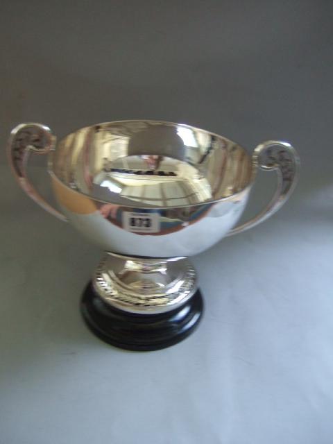 Appraisal: A silver twin handled large trophy cup the handles and