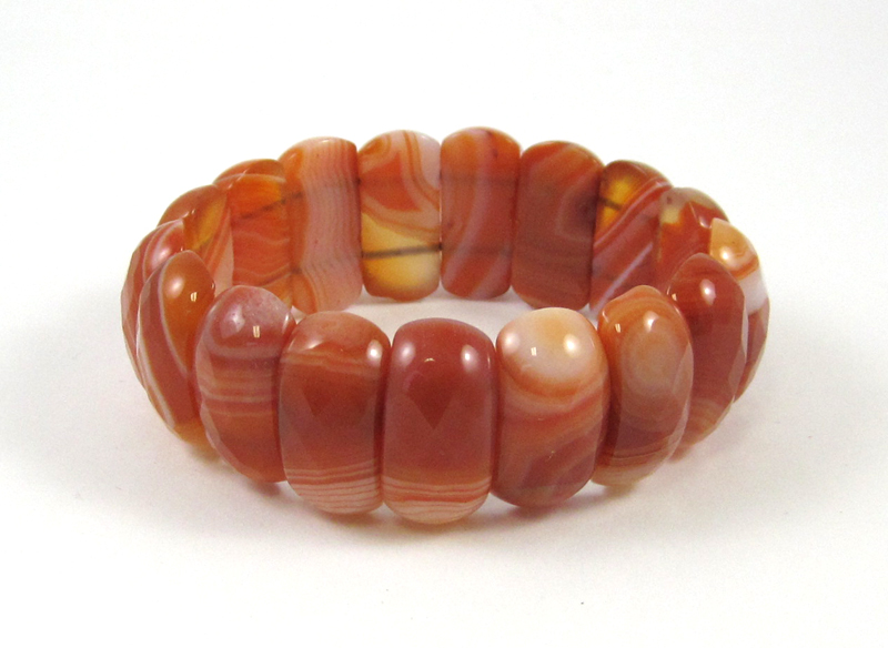 Appraisal: CARNELIAN AGATE STRETCH BRACELET with large faceted carnelian beads each