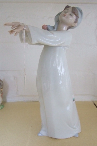 Appraisal: A Lladro figure modeled as a sleep walking boy No