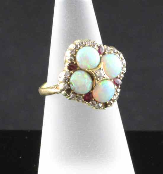 Appraisal: A gold white opal ruby and diamond cluster dress ring