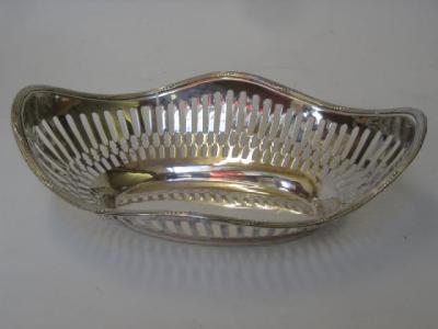 Appraisal: A CONTINENTAL FRUIT BASKET of shaped oval form the fluted