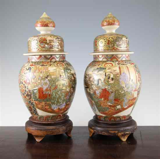 Appraisal: A pair of Japanese Satsuma pottery ovoid jars and covers