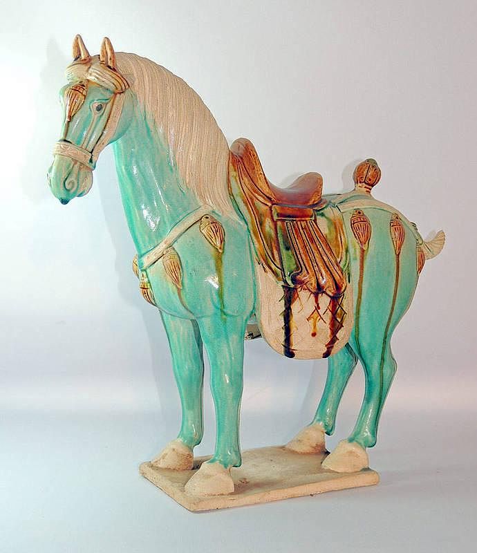 Appraisal: Tang-style Pottery Horse Tang-style pottery horse with sancai glaze The