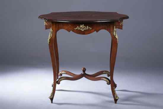 Appraisal: LOUIS XV STYLE GILT-METAL MOUNTED ROSEWOOD CENTER TABLE Shaped top