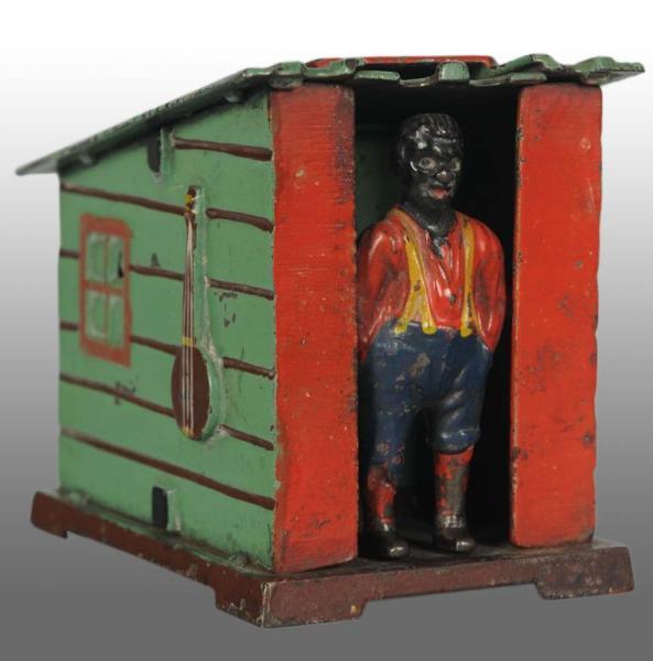 Appraisal: Cast Iron Cabin Mechanical Bank Description American Manufactured by J