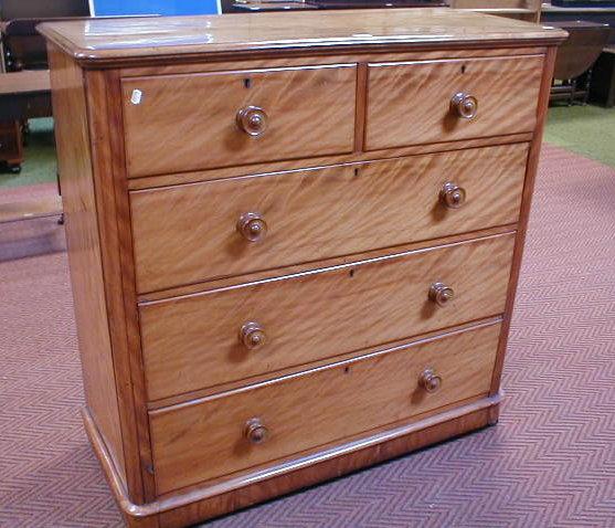 Appraisal: A Victorian satin birch chest of two short and three