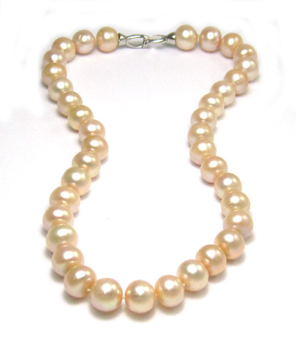 Appraisal: PRINCESS LENGTH PINK PEARL NECKLACE strung with well matched pink