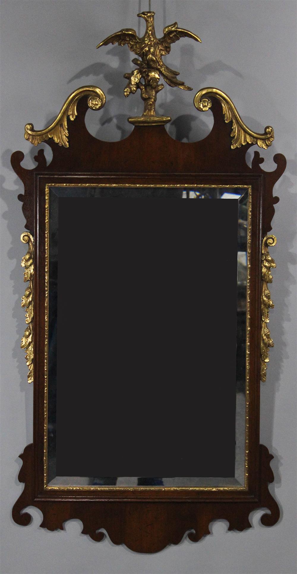 Appraisal: CHIPPENDALE STYLE MAHOGANY AND CARVED GILT MIRROR having a carved