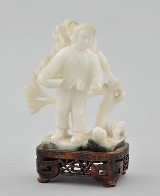 Appraisal: A Chinese Carved Milky Grey Jade Depicting a boy feeding