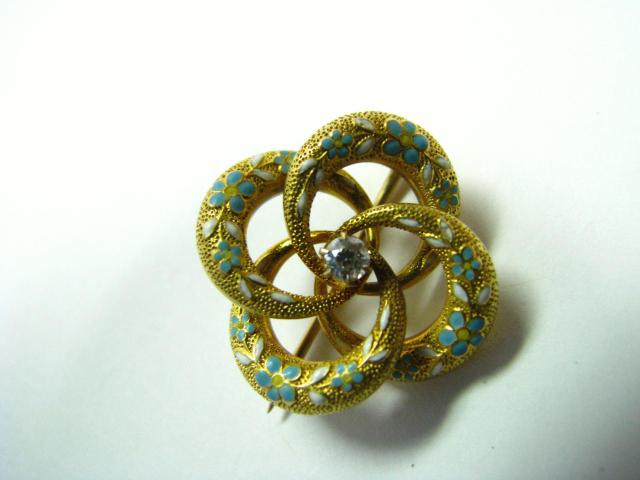 Appraisal: K Yellow gold antique enameled diamond pin four-circle love knot