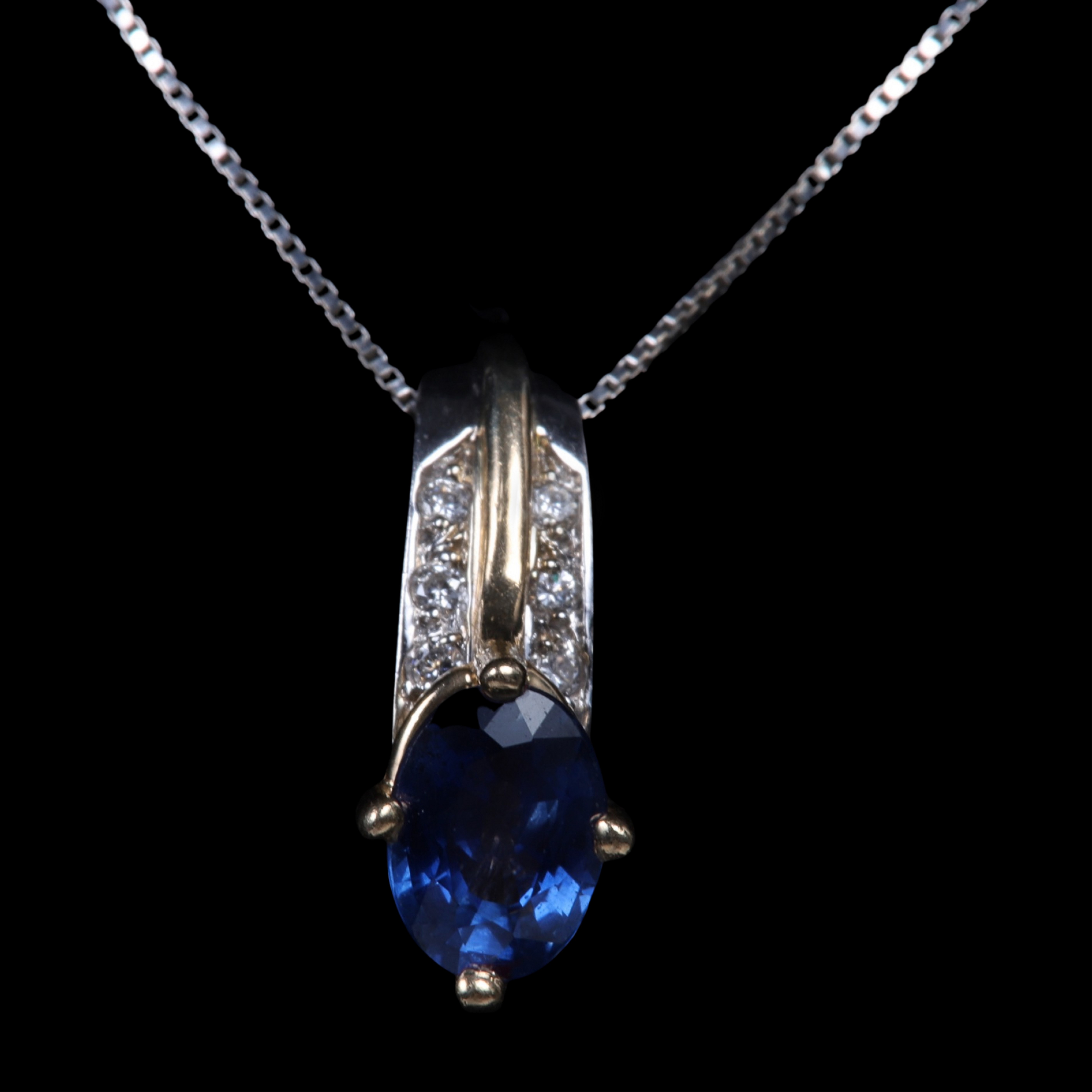 Appraisal: K gold sapphire and diamond pendant on chain mm x