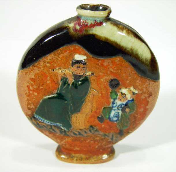 Appraisal: Oriental stoneware vase relief moulded with figures playing musical instruments