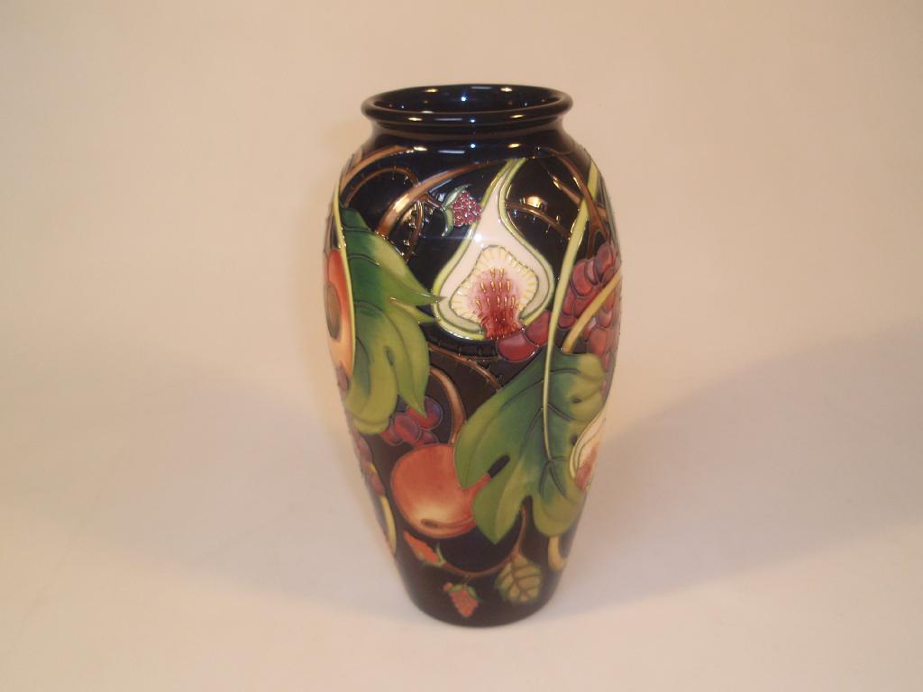 Appraisal: Moorcroft Modern a baluster vase decorated with fruit including figs