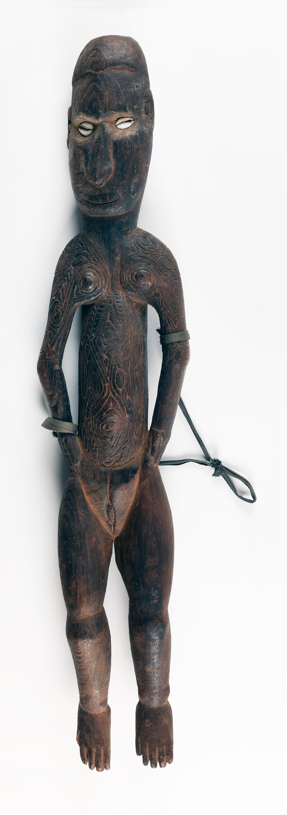 Appraisal: AFRICAN OR OCEANIC CARVED WOOD FEMALE FIGURE WITH COWRIE SHELL