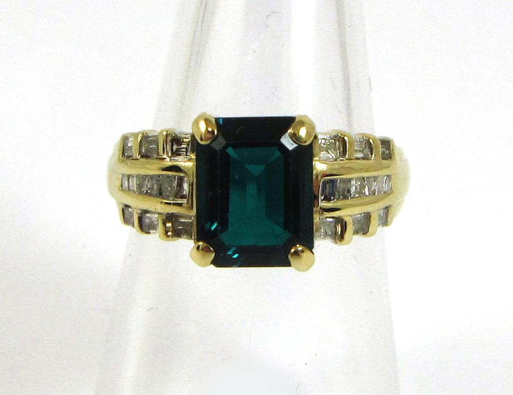 Appraisal: SYNTHETIC EMERALD AND FOURTEEN KARAT GOLD RING with six princess-cut