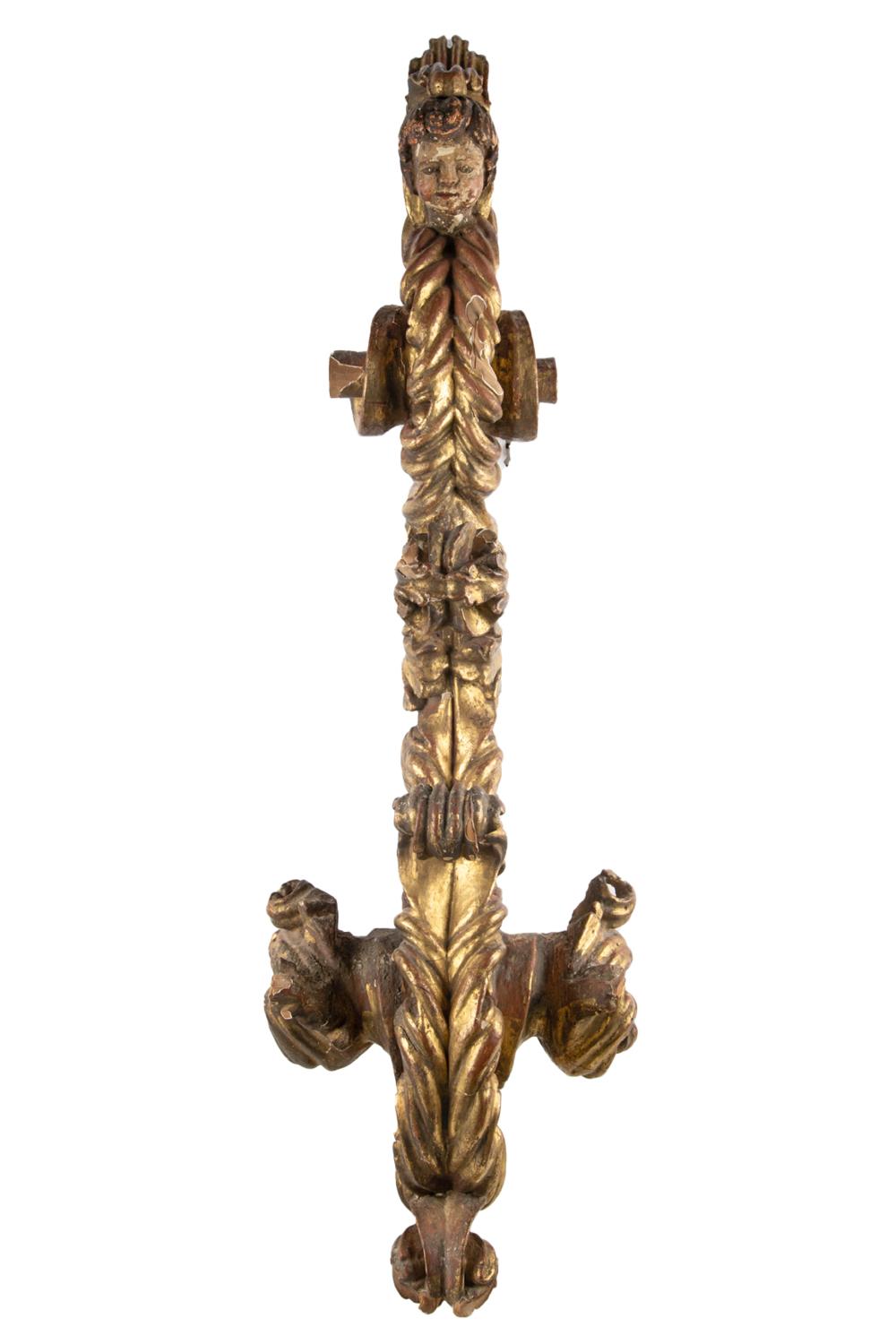 Appraisal: VENETIAN ROCOCO GILT CARVED WOOD ARCHITECTURAL FRAGMENTwith a polychrome-painted head