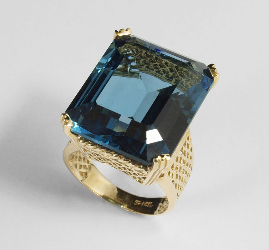 Appraisal: CT BLUE TOPAZ RING A regal ''London Blue'' emerald cut