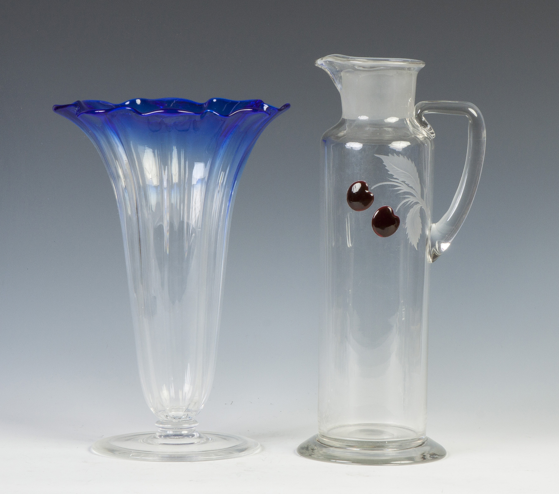 Appraisal: Steuben Blue Clear Grotesque Vase Martini Pitcher with Applied Cherries