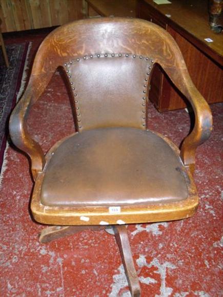 Appraisal: An oak framed revolving office chair