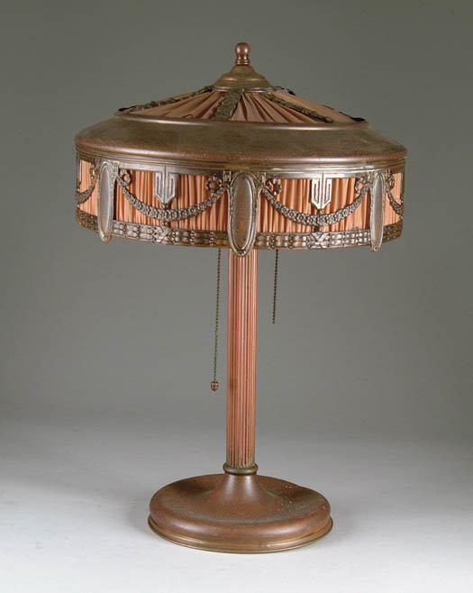 Appraisal: BRASS AND SILK TABLE LAMP The overlay top grill with