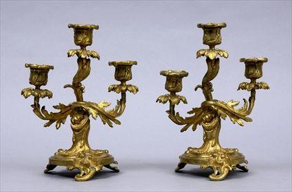 Appraisal: PAIR OF LOUIS XV-STYLE GILT-BRONZE SMALL THREE-LIGHT CANDELABRA Each spiral