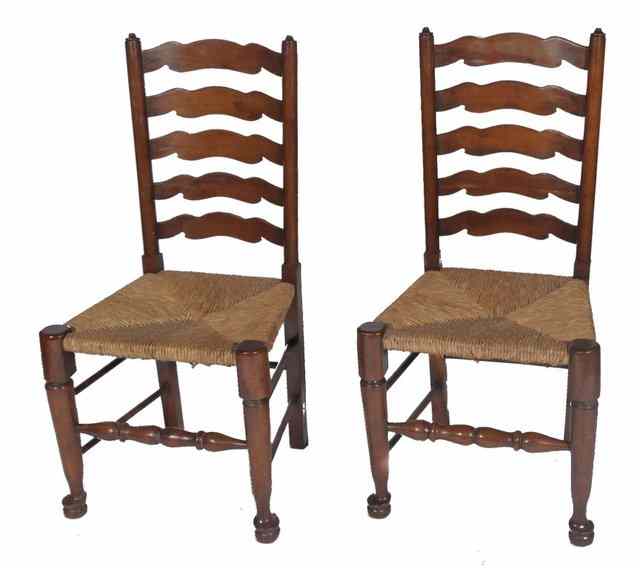 Appraisal: A SET OF FOUR YEW LADDER BACK DINING CHAIRS each