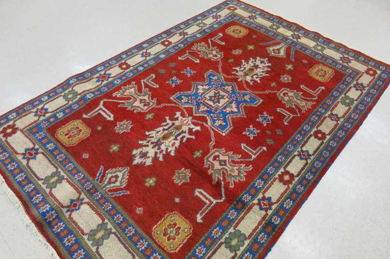 Appraisal: HAND KNOTTED ORIENTAL CARPET Indo-Persian stylized floral and central geometric