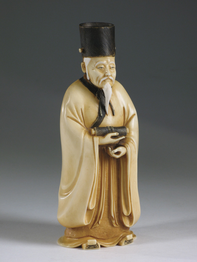 Appraisal: JAPANESE HAND CARVED SOLID IVORY FIGURE OF A SCHOLAR having