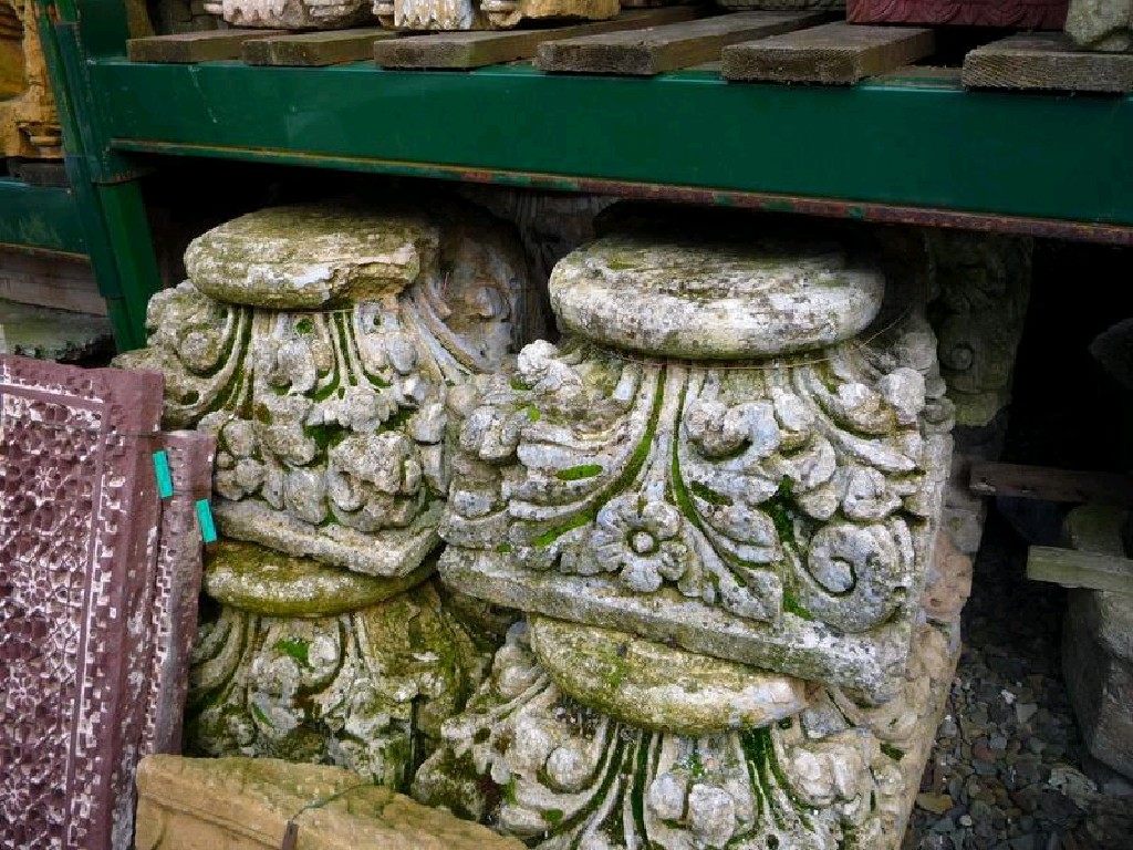 Appraisal: Pair of carved stone Capitals with floral and scroll design