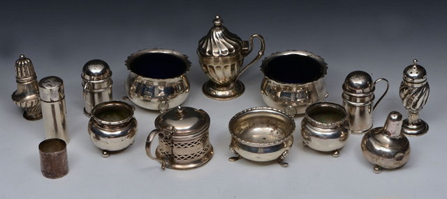 Appraisal: A PAIR OF SILVER POUNCE POTS with drilled press on