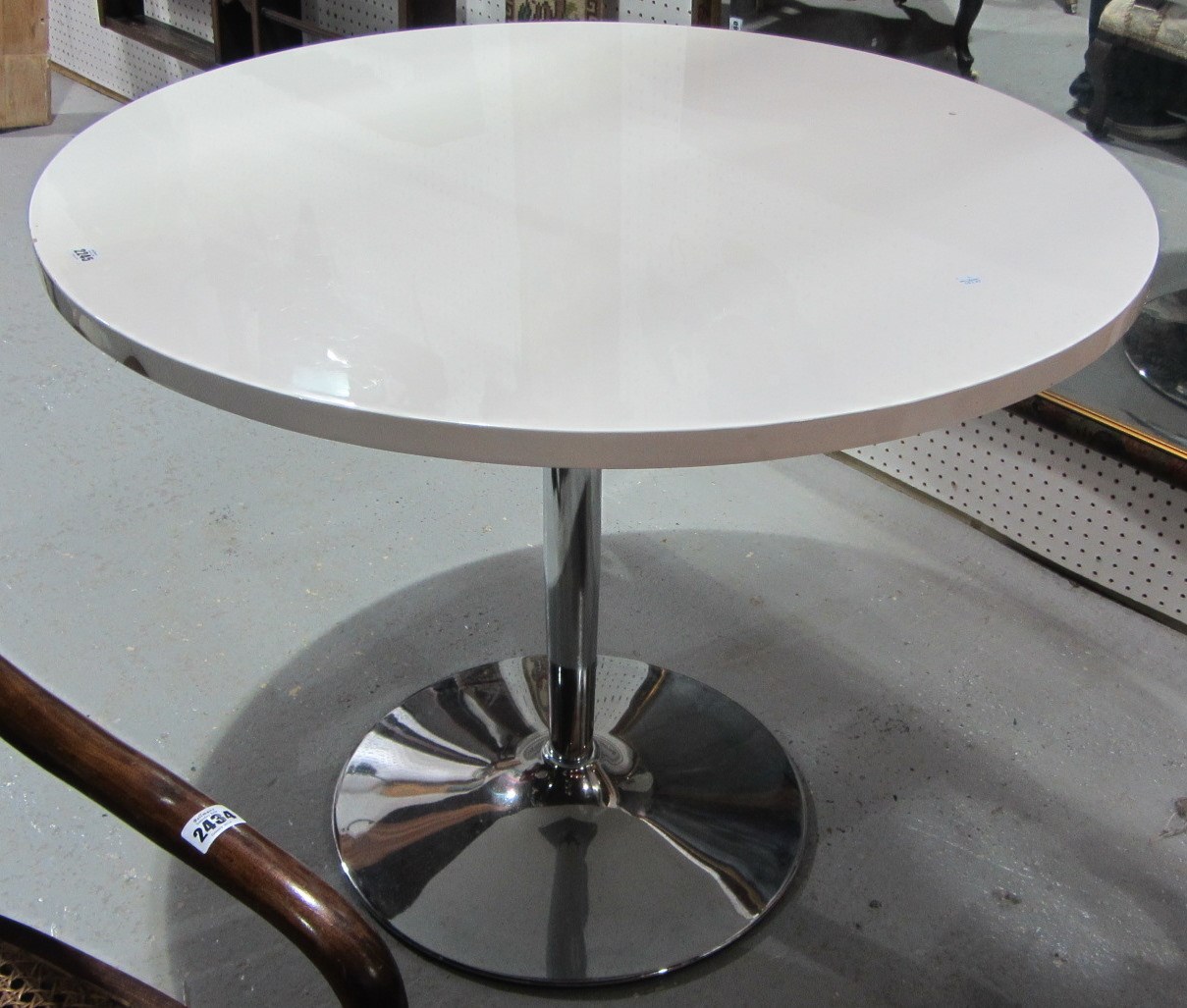 Appraisal: A th century circular white painted dining table with chrome