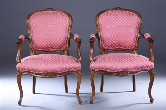 Appraisal: PAIR LOUIS XV STYLE CARVED FRUITWOOD FAUTEUILS th century with