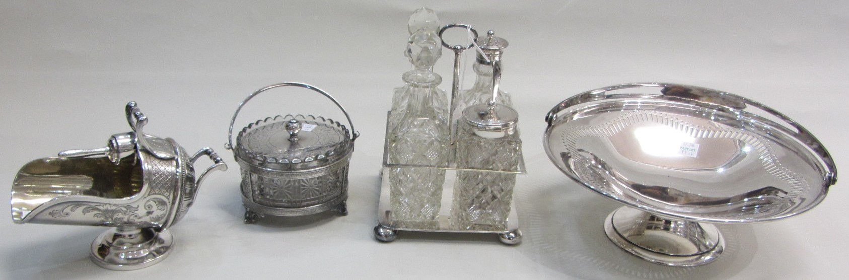 Appraisal: Plated wares comprising a four bottle cruet stand fitted with