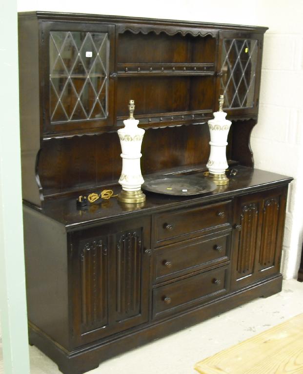 Appraisal: Replica oak dresser with two shelves flanked by opposing lead