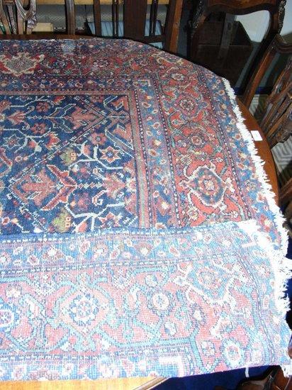 Appraisal: A HAMMERDAN BLUE GROUND RUG with allover foliate designs within