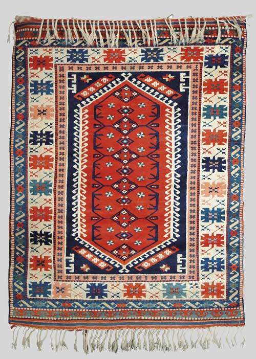 Appraisal: CAUCASIAN SCATTER RUG Central rust field medallion surrounded by a