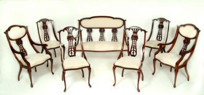 Appraisal: A VICTORIAN MAHOGANY SALON SUITE upholstered in ivory and pink